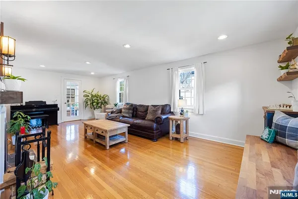 a kitchen with stainless steel appliances granite countertop white cabinets a sink and dishwasher