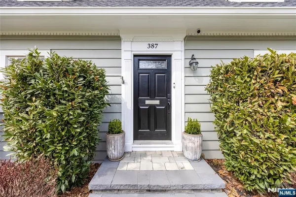a view of a patio with a table and chairs
