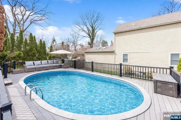 a living room with fireplace furniture and a flat screen tv