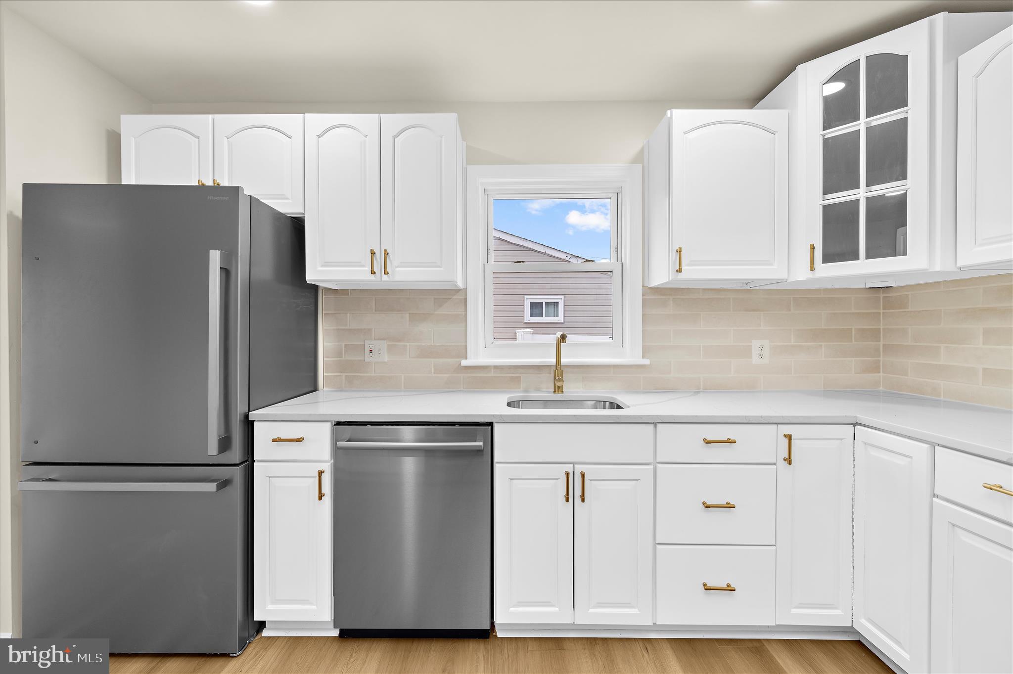 7831 Overhill Road Glen Burnie, MD 21060 - Photo 13 of 57 a kitchen with cabinets appliances and a center island