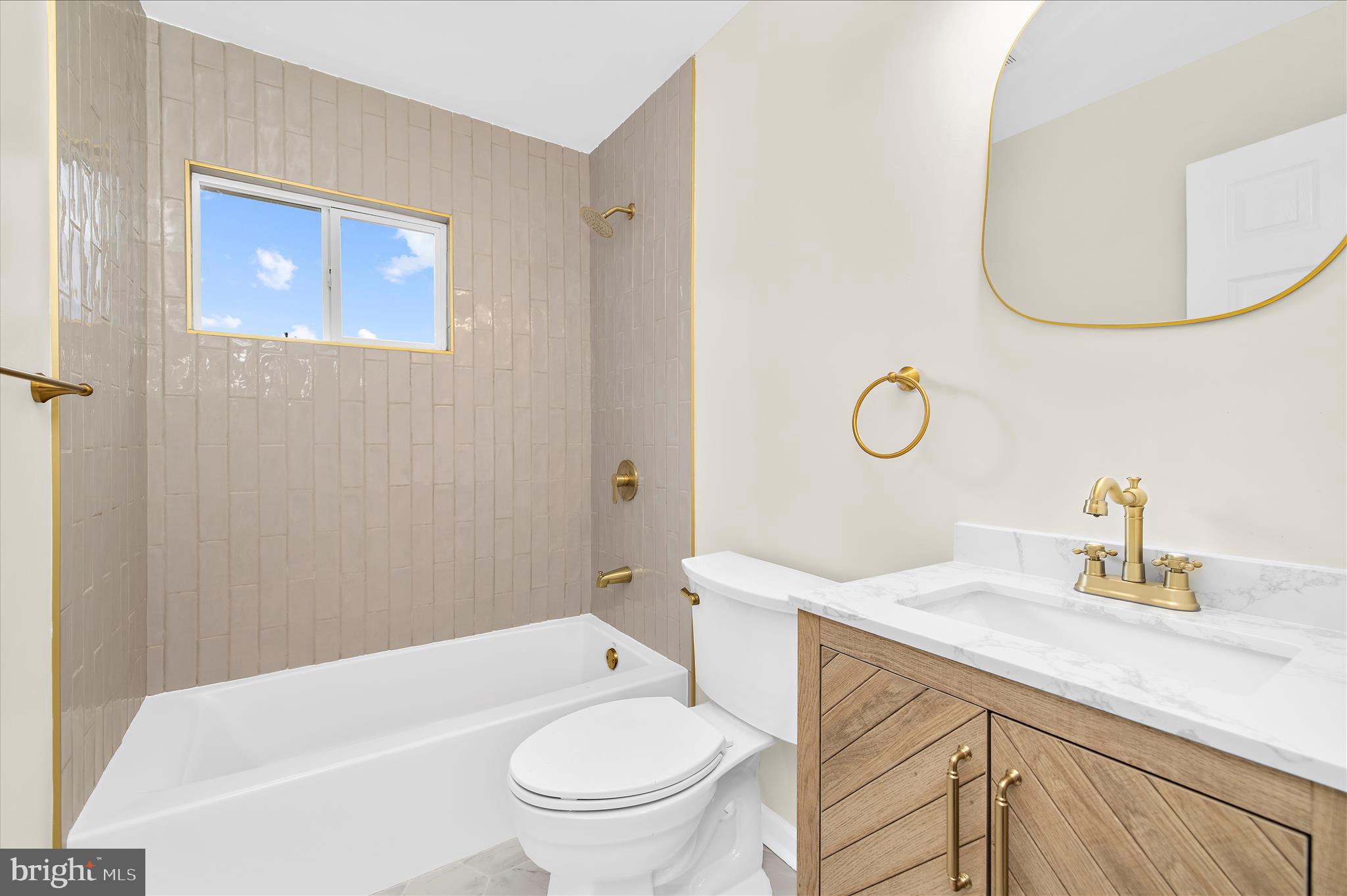 7831 Overhill Road Glen Burnie, MD 21060 - Photo 14 of 57 a bathroom with a sink a toilet and shower
