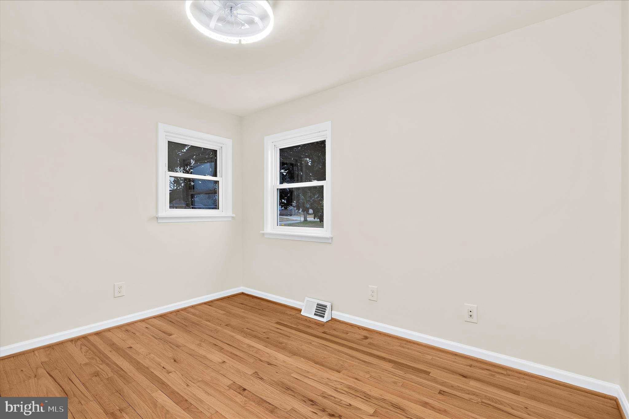 7831 Overhill Road Glen Burnie, MD 21060 - Photo 16 of 57 a view of a room with wooden floor and a window