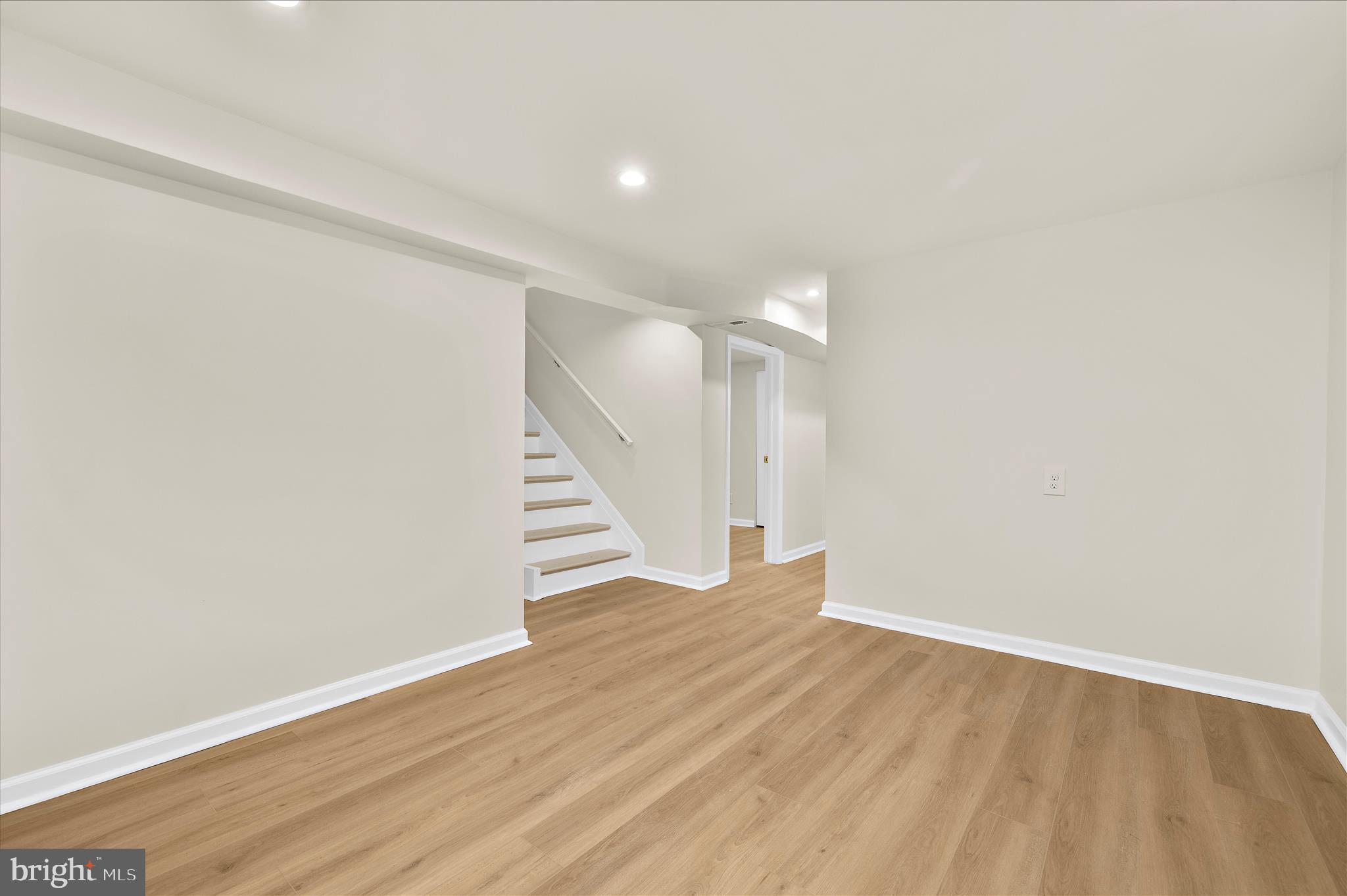 7831 Overhill Road Glen Burnie, MD 21060 - Photo 23 of 57 a view of an empty room with wooden floor