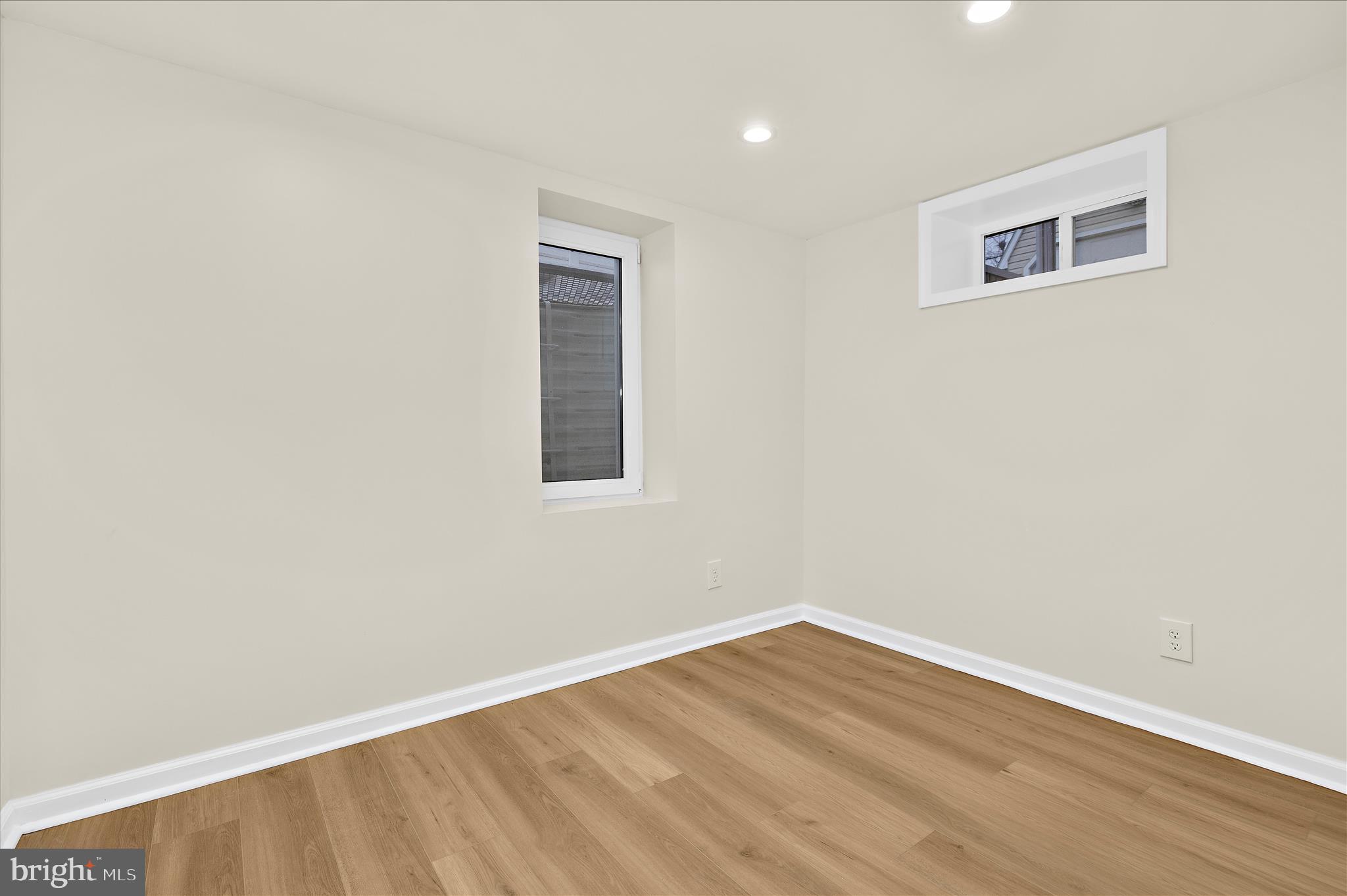 7831 Overhill Road Glen Burnie, MD 21060 - Photo 24 of 57 a view of an empty room with wooden floor