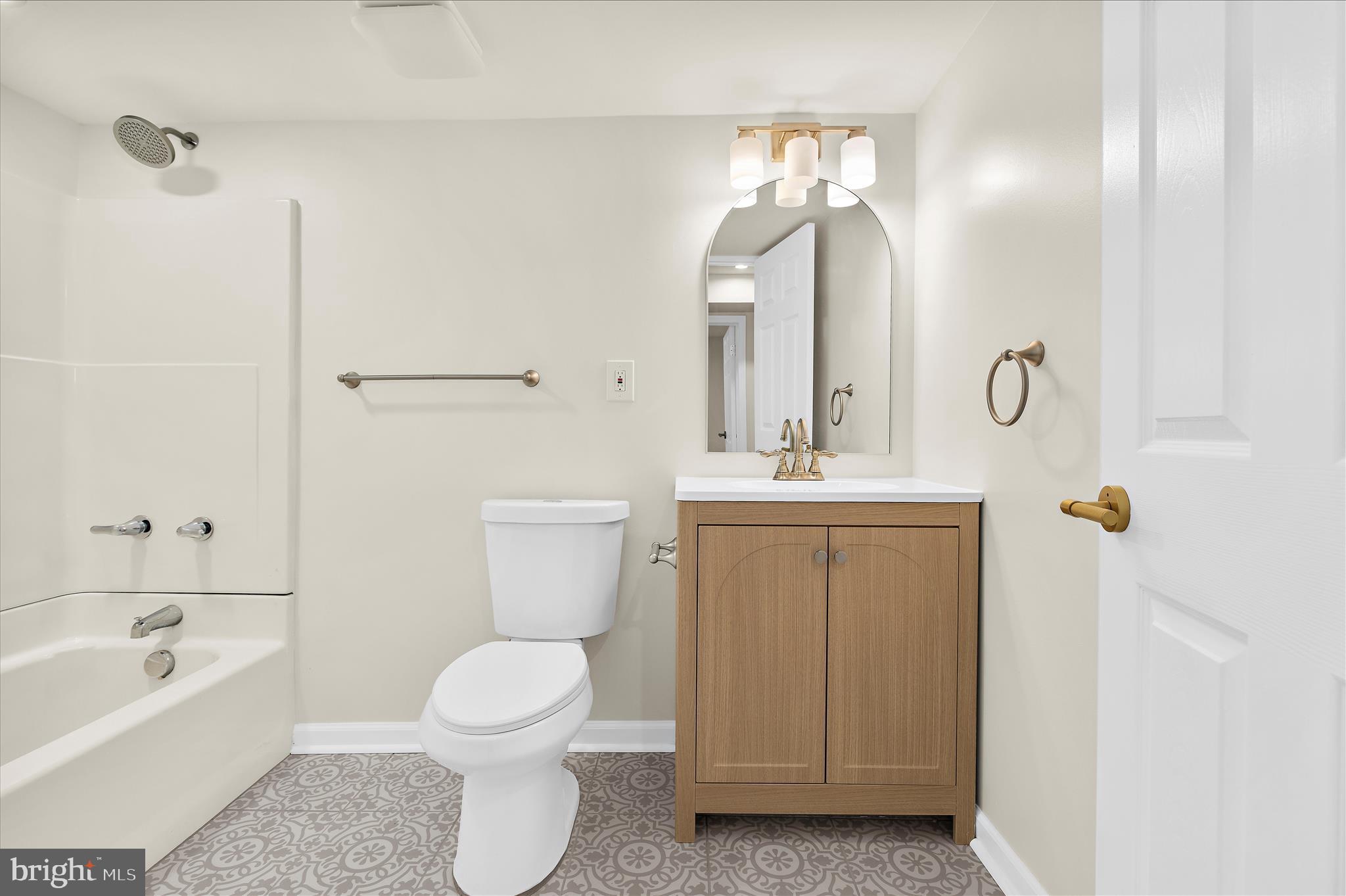 7831 Overhill Road Glen Burnie, MD 21060 - Photo 25 of 57 a bathroom with a toilet sink and mirror