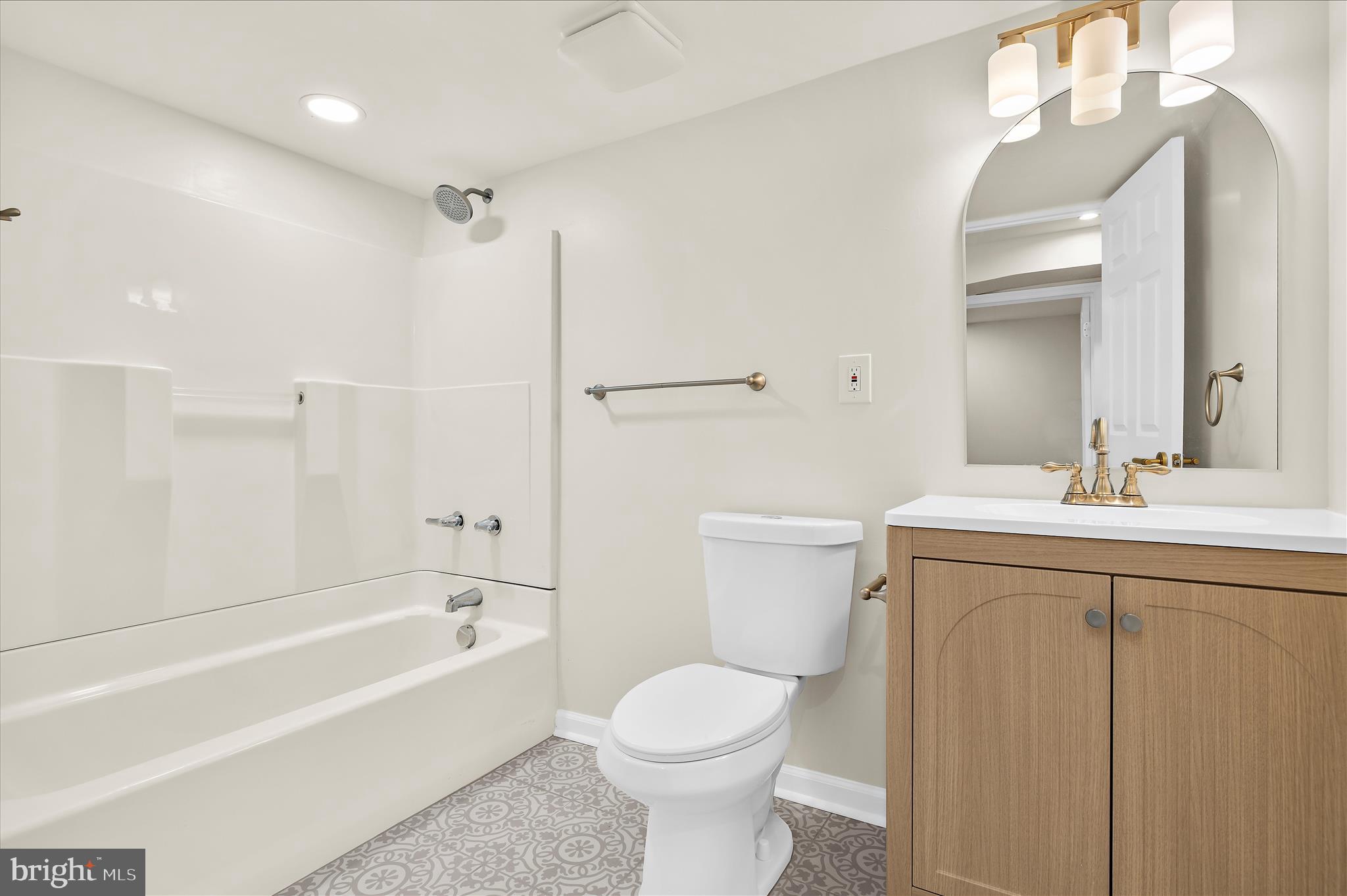 7831 Overhill Road Glen Burnie, MD 21060 - Photo 26 of 57 a bathroom with a sink toilet and shower