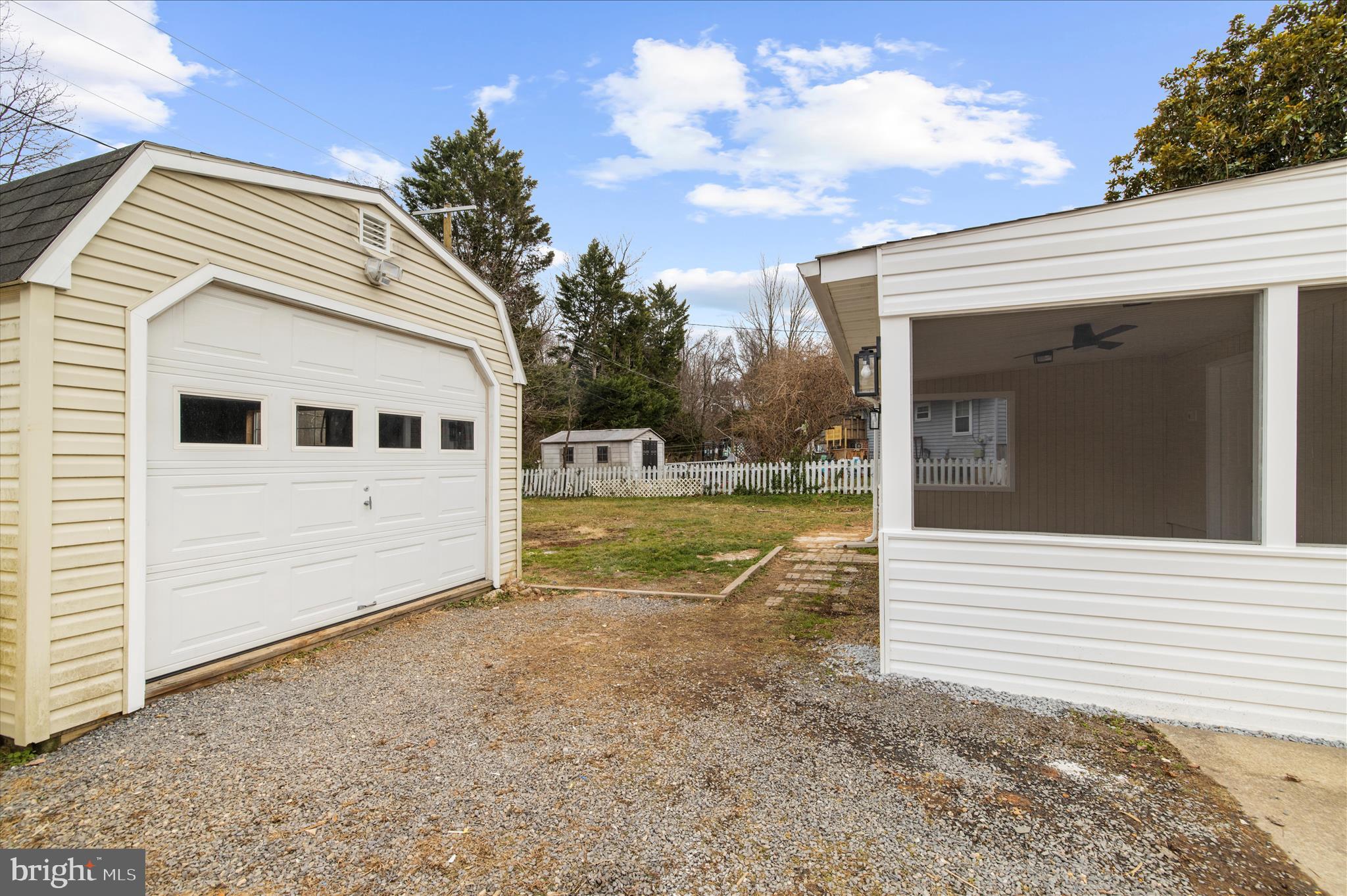7831 Overhill Road Glen Burnie, MD 21060 - Photo 35 of 57 a view of a white house with a yard