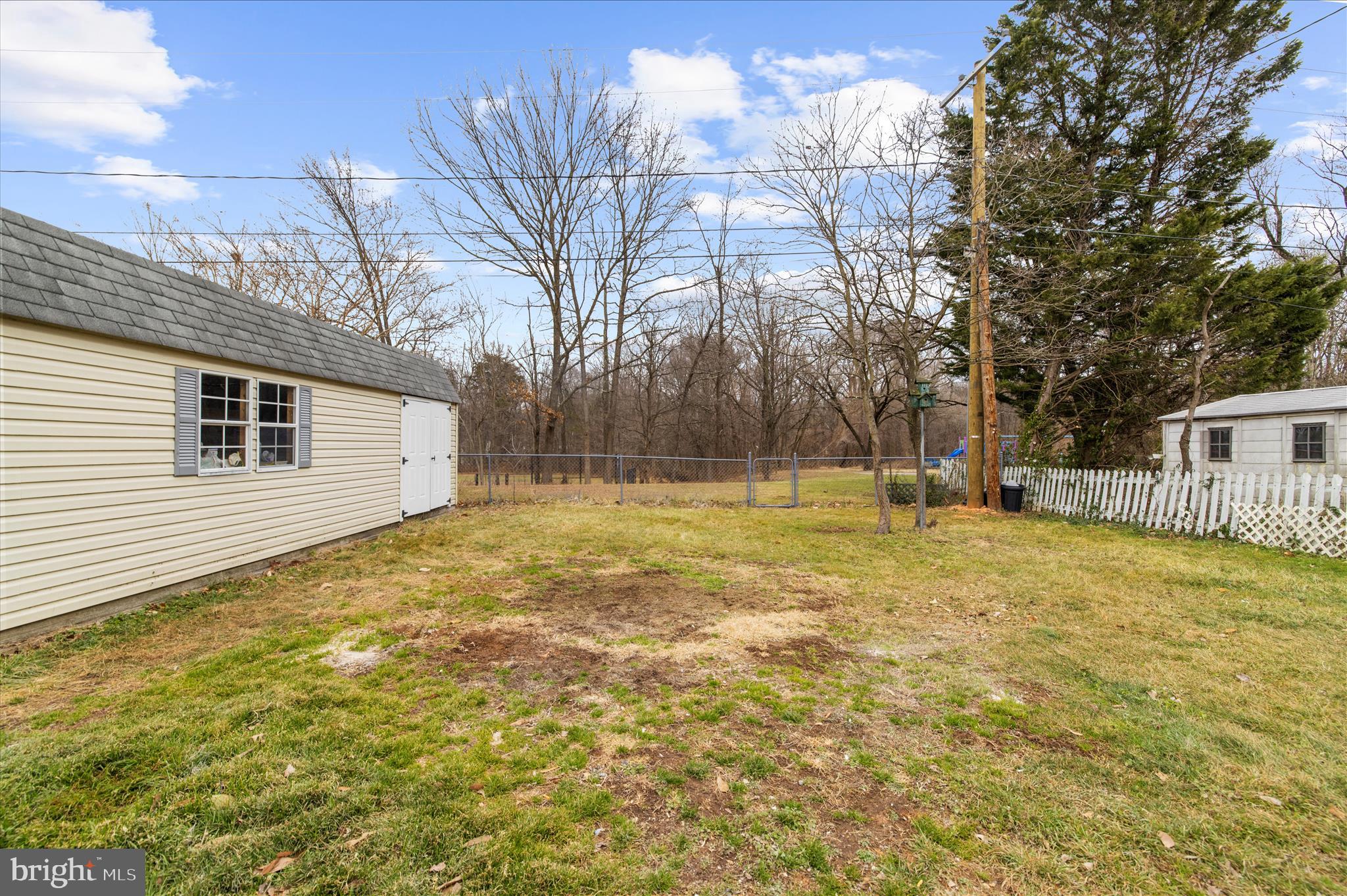 7831 Overhill Road Glen Burnie, MD 21060 - Photo 36 of 57 a backyard of a house with large trees