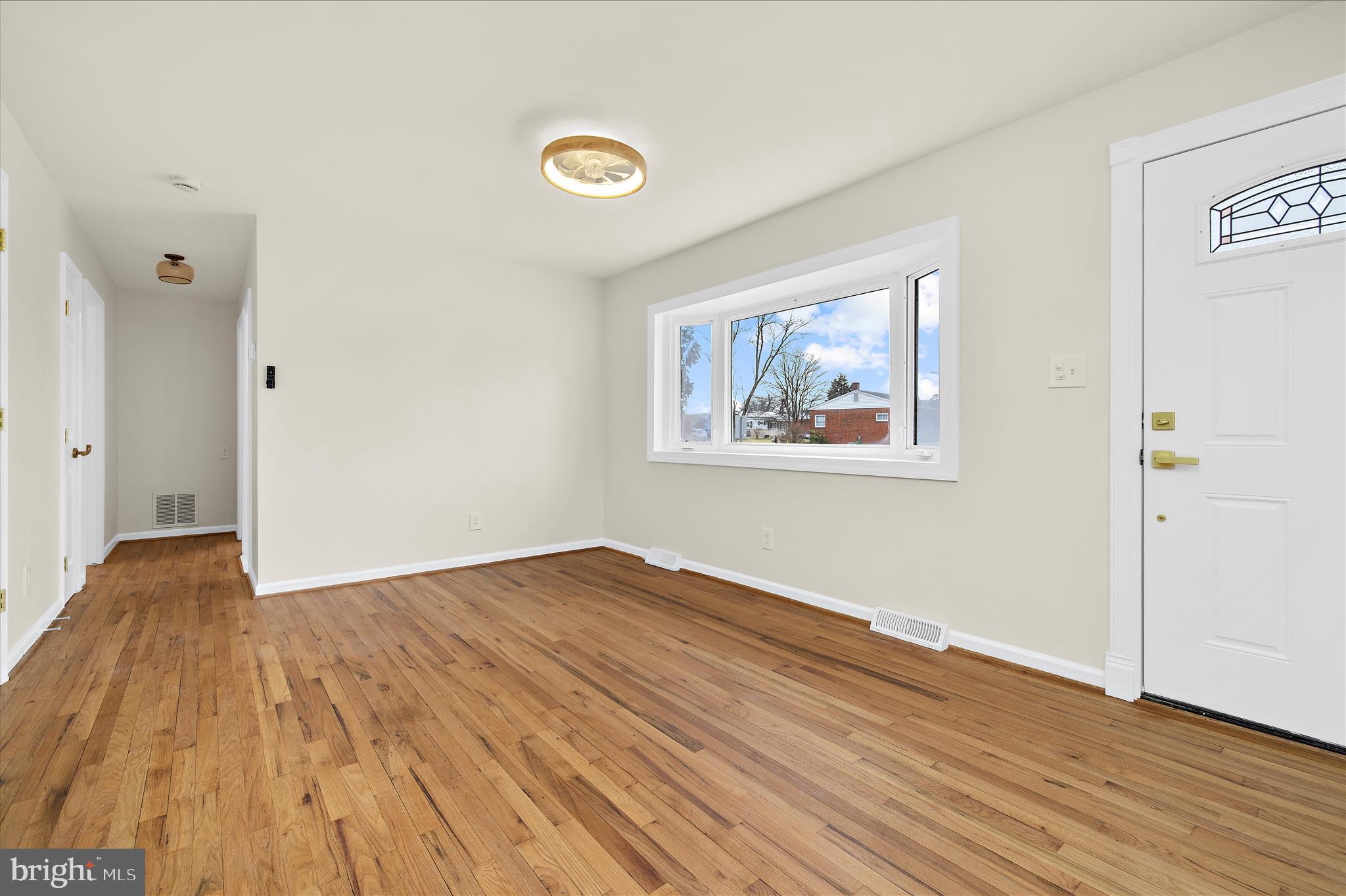 7831 Overhill Road Glen Burnie, MD 21060 - Photo 6 of 57 a view of empty room with wooden floor