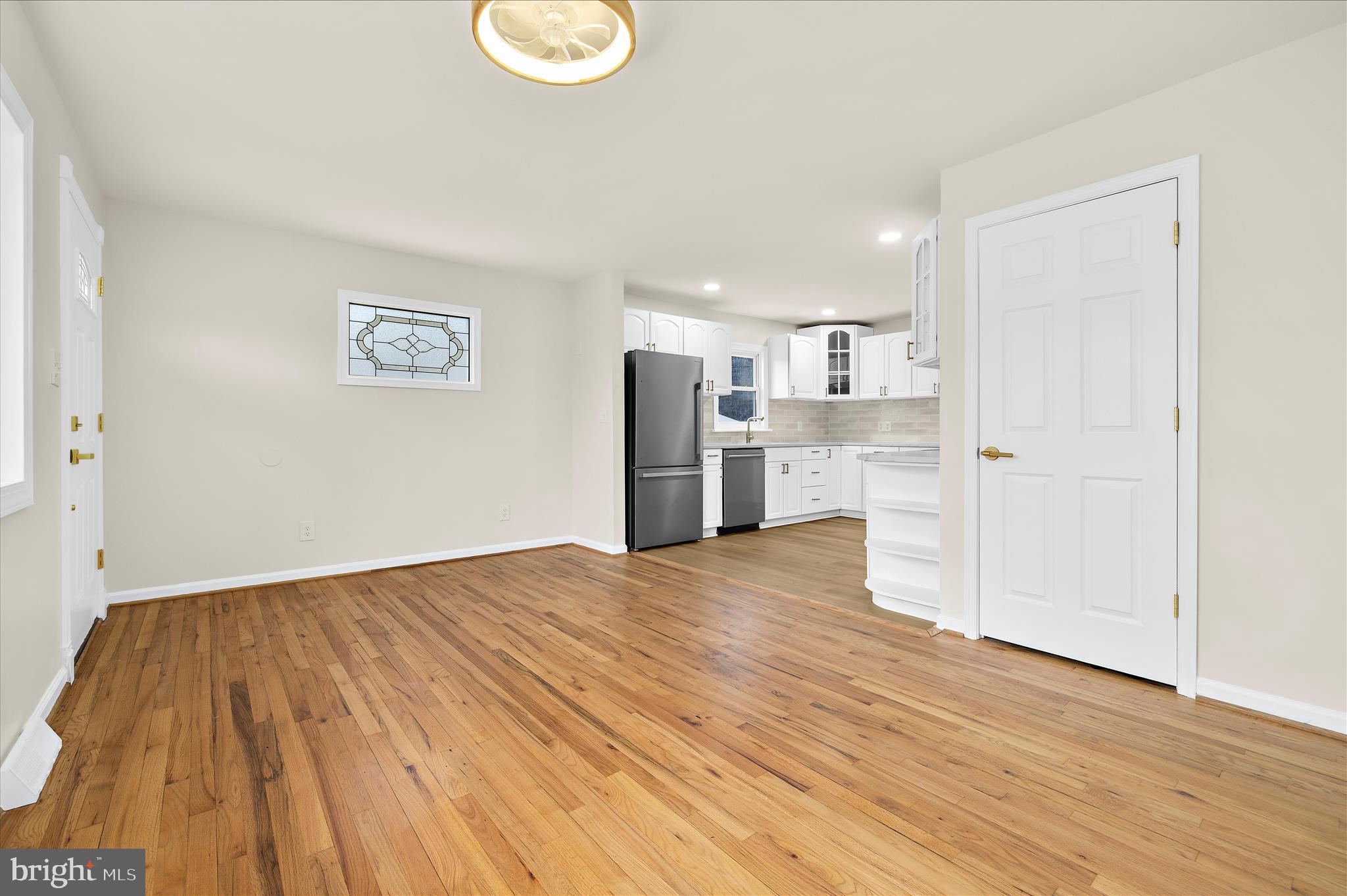 7831 Overhill Road Glen Burnie, MD 21060 - Photo 7 of 57 a view of a kitchen with a sink and a refrigerator