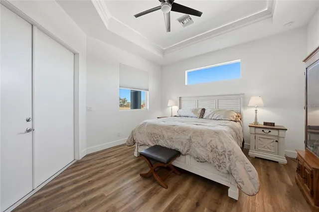 a bedroom with a bed and a table