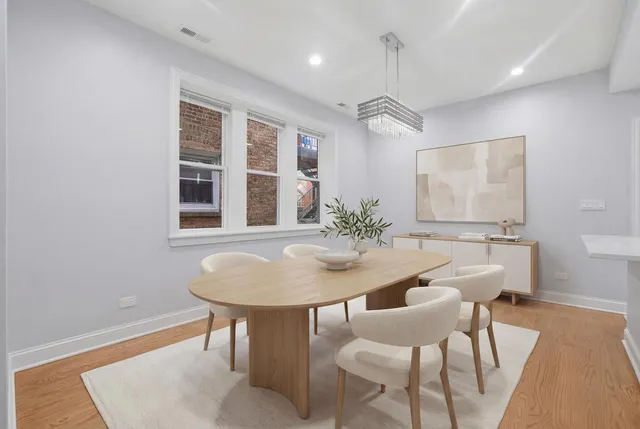 a view of a dining room with furniture and window