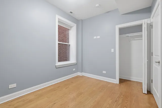 wooden floor and window in an empty room
