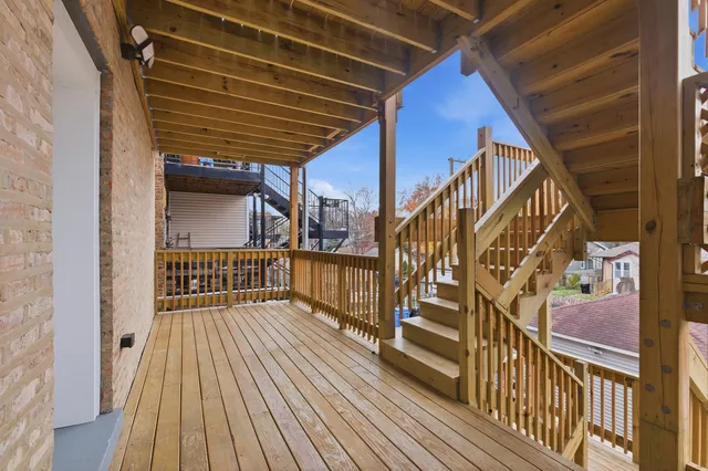 a view of balcony with wooden floor
