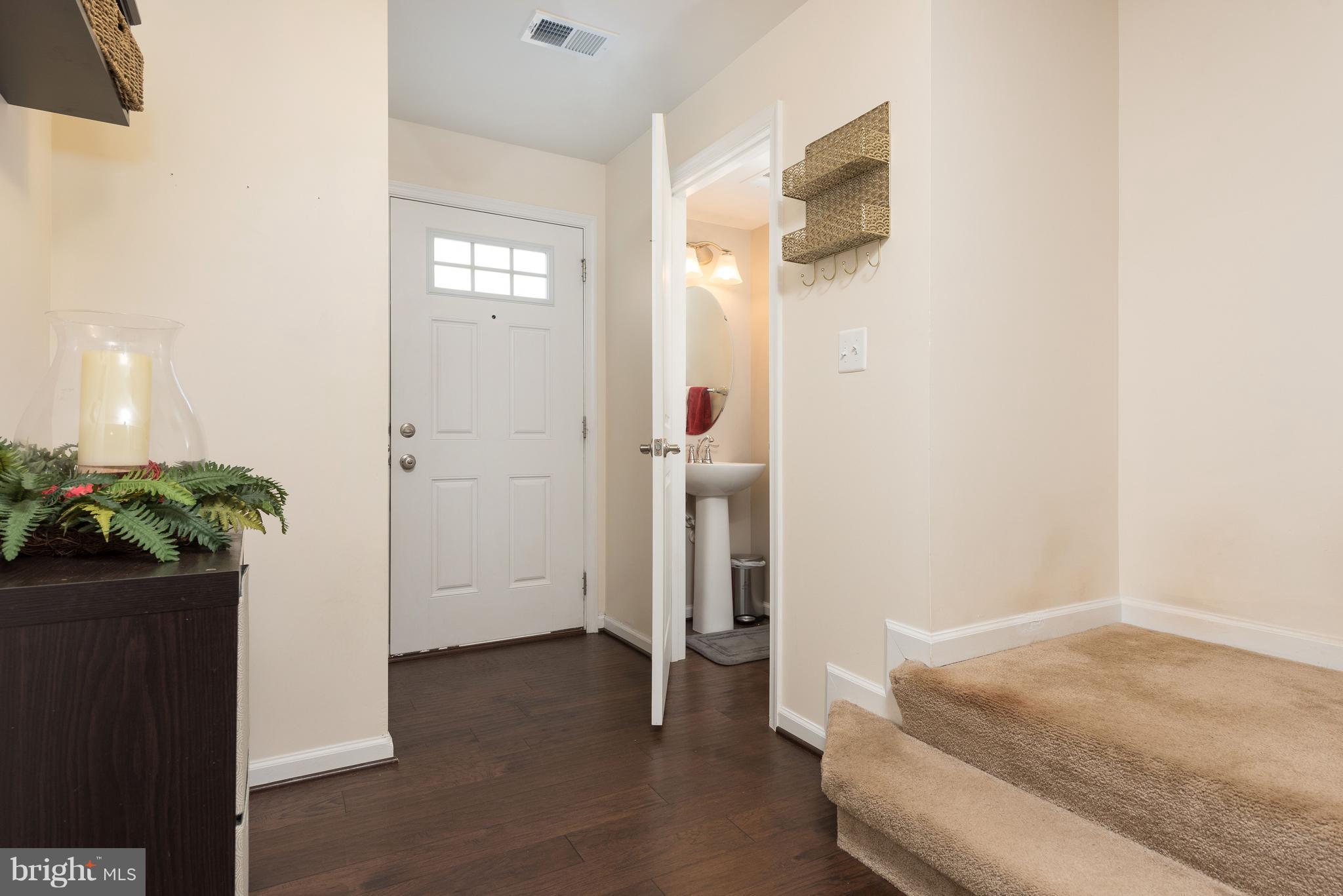 108 Brenton Road Fredericksburg, VA 22405 - Photo 2 of 24 a bedroom with a bed and hallway