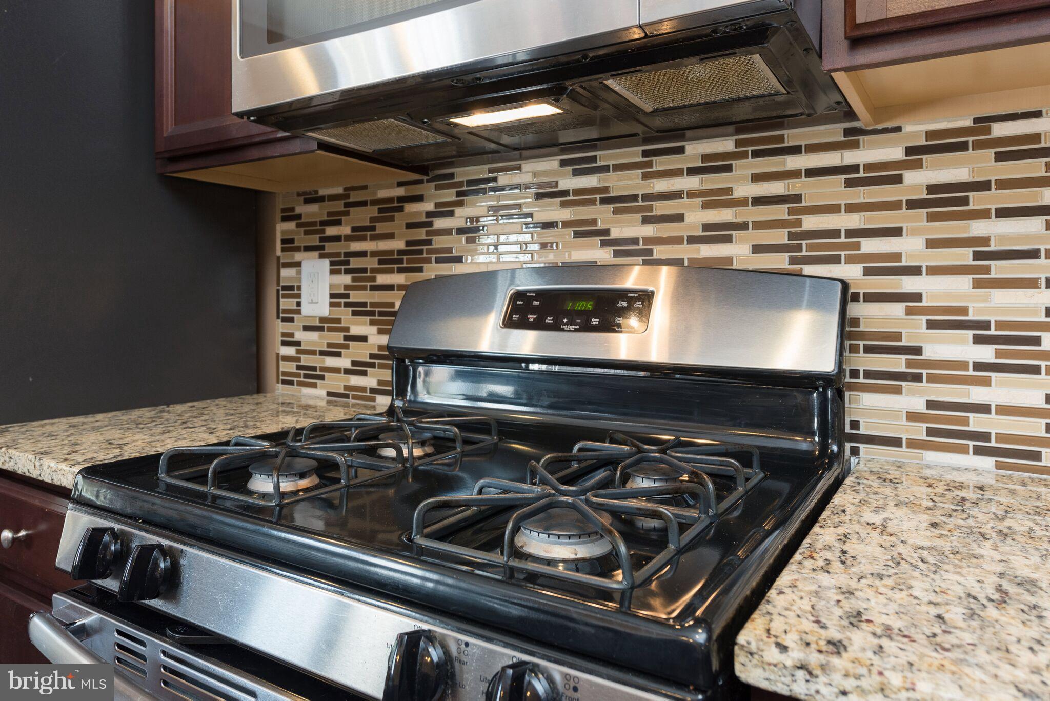 108 Brenton Road Fredericksburg, VA 22405 - Photo 14 of 24 a stove sitting inside of a kitchen with granite countertop