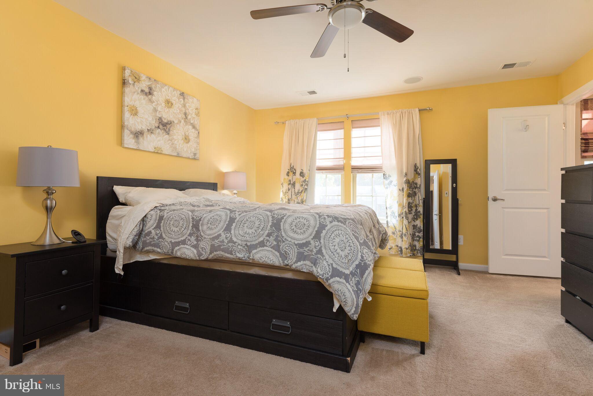 108 Brenton Road Fredericksburg, VA 22405 - Photo 17 of 24 a bedroom with a bed and a painting on the wall