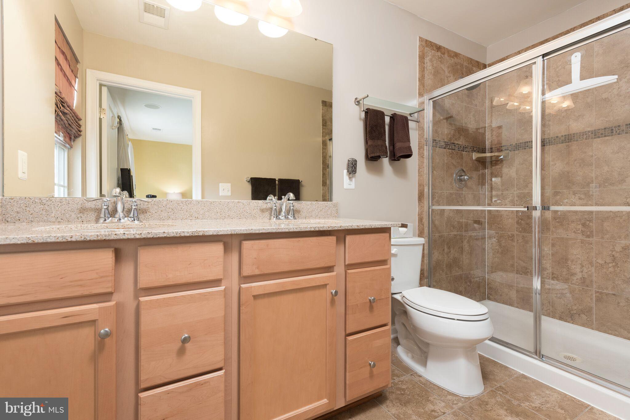 108 Brenton Road Fredericksburg, VA 22405 - Photo 19 of 24 a bathroom with a granite countertop sink toilet and shower