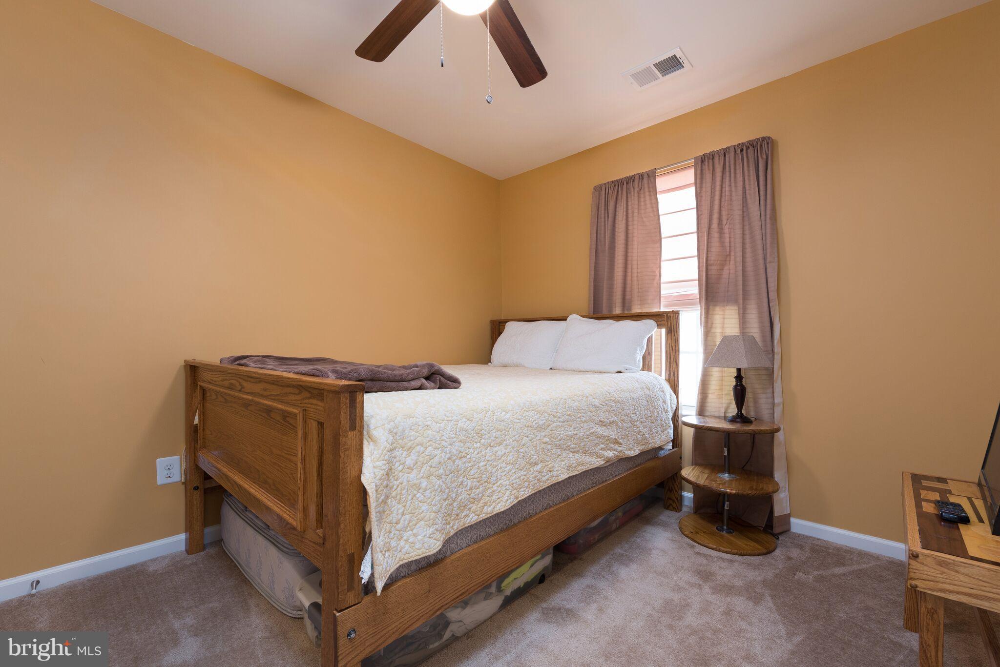 108 Brenton Road Fredericksburg, VA 22405 - Photo 21 of 24 a bedroom with a bed and a window