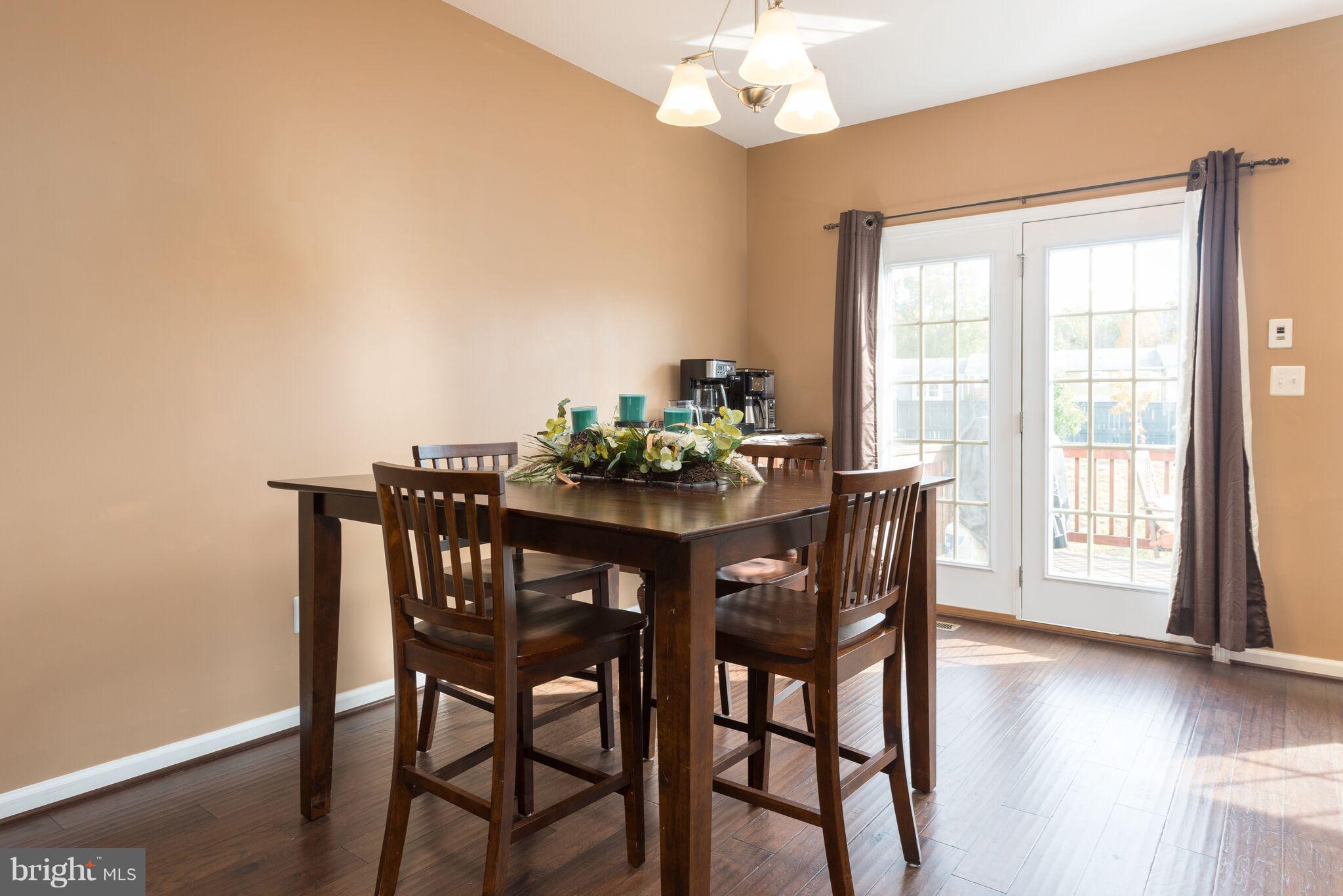 108 Brenton Road Fredericksburg, VA 22405 - Photo 9 of 24 a view of a dining room with furniture wooden floor and chandelier