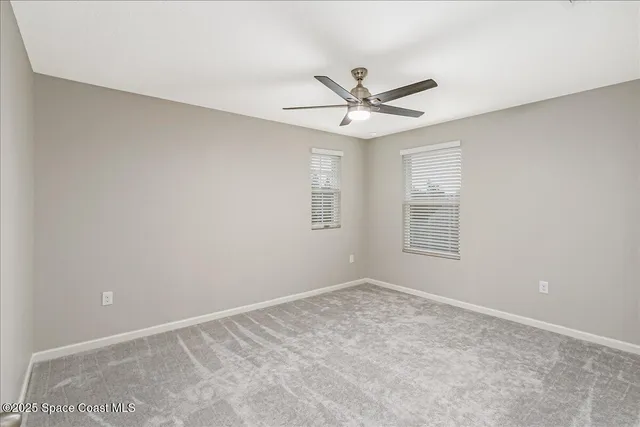 a bathroom with a sink a toilet and a large mirror