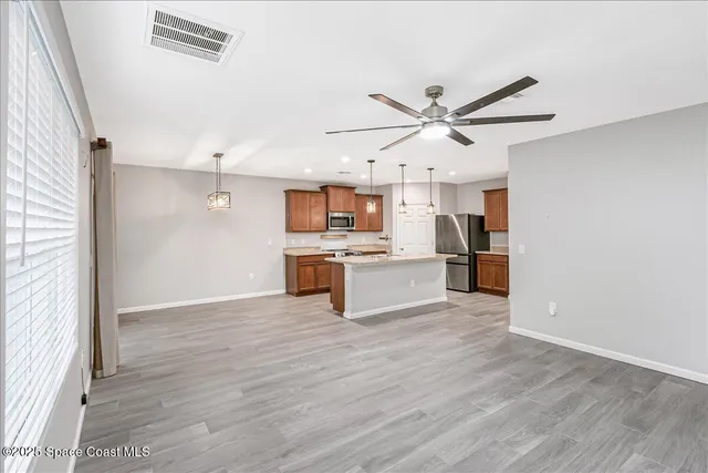 a view of kitchen with wooden floor