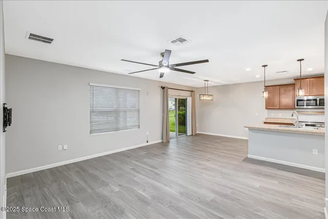 a view of a kitchen with a sink and a window