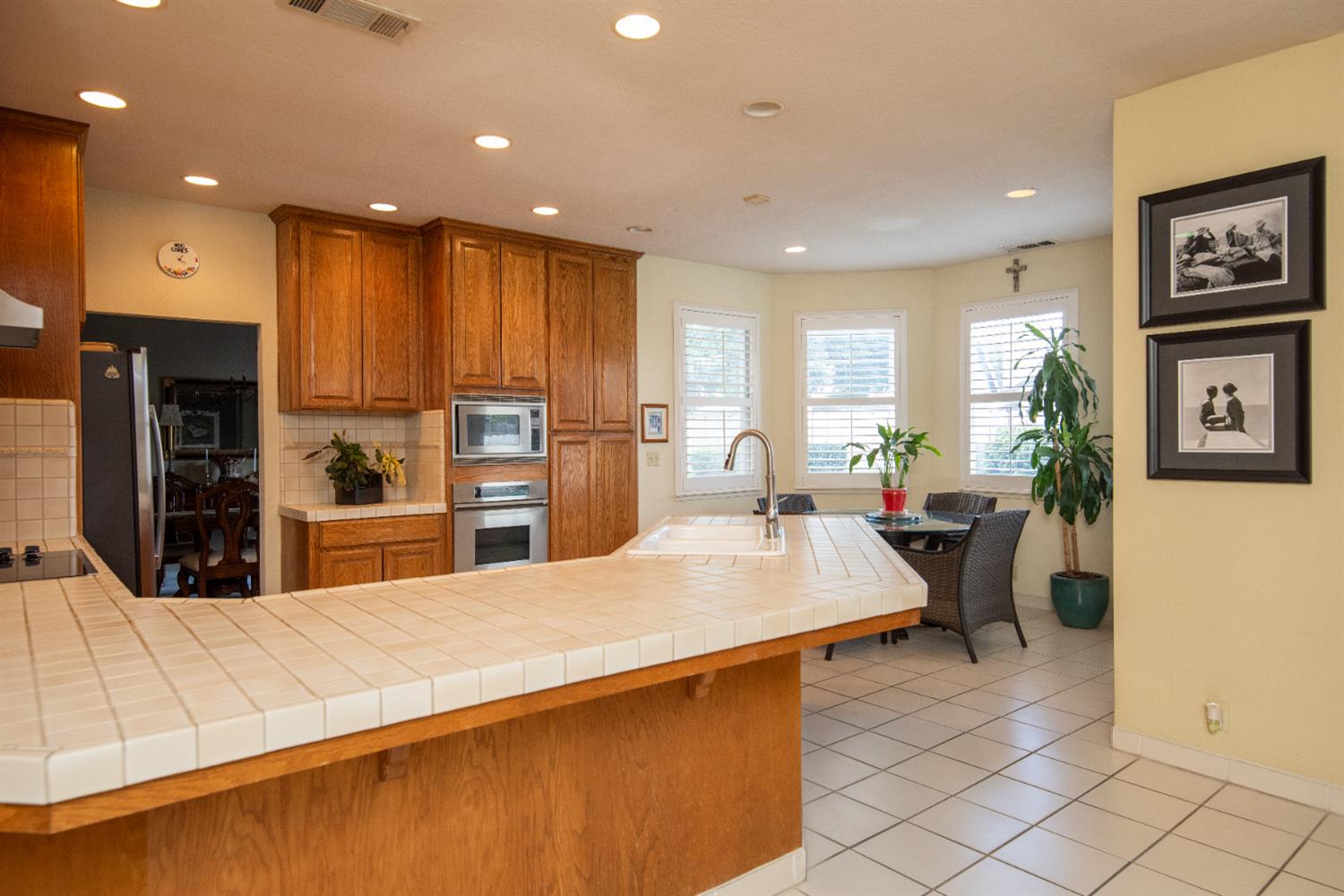 2705 Lake Front Court Modesto, CA 95355 - Photo 12 of 50 a large kitchen with kitchen island a large counter top stainless steel appliances and cabinets