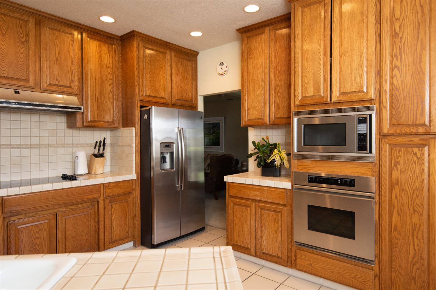 2705 Lake Front Court Modesto, CA 95355 - Photo 18 of 50 a kitchen with stainless steel appliances granite countertop a refrigerator stove top oven and sink
