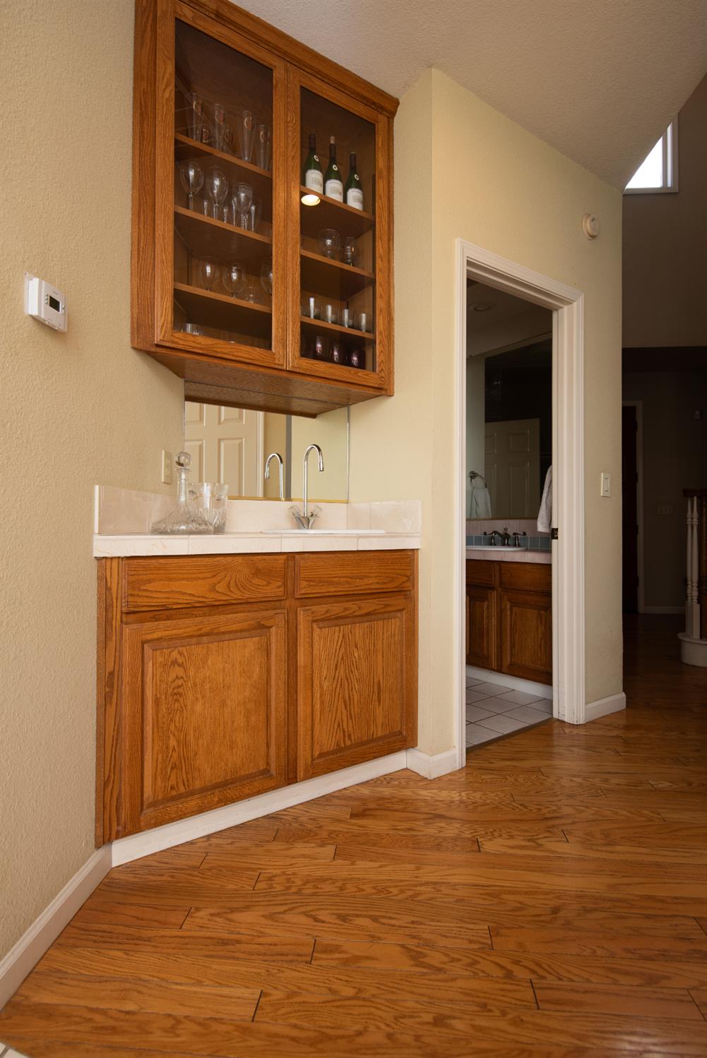 2705 Lake Front Court Modesto, CA 95355 - Photo 22 of 50 a view of a kitchen with stainless steel appliances granite countertop a sink and cabinets