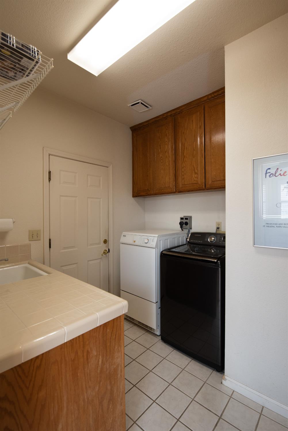 2705 Lake Front Court Modesto, CA 95355 - Photo 24 of 50 a kitchen with a sink and a stove top oven