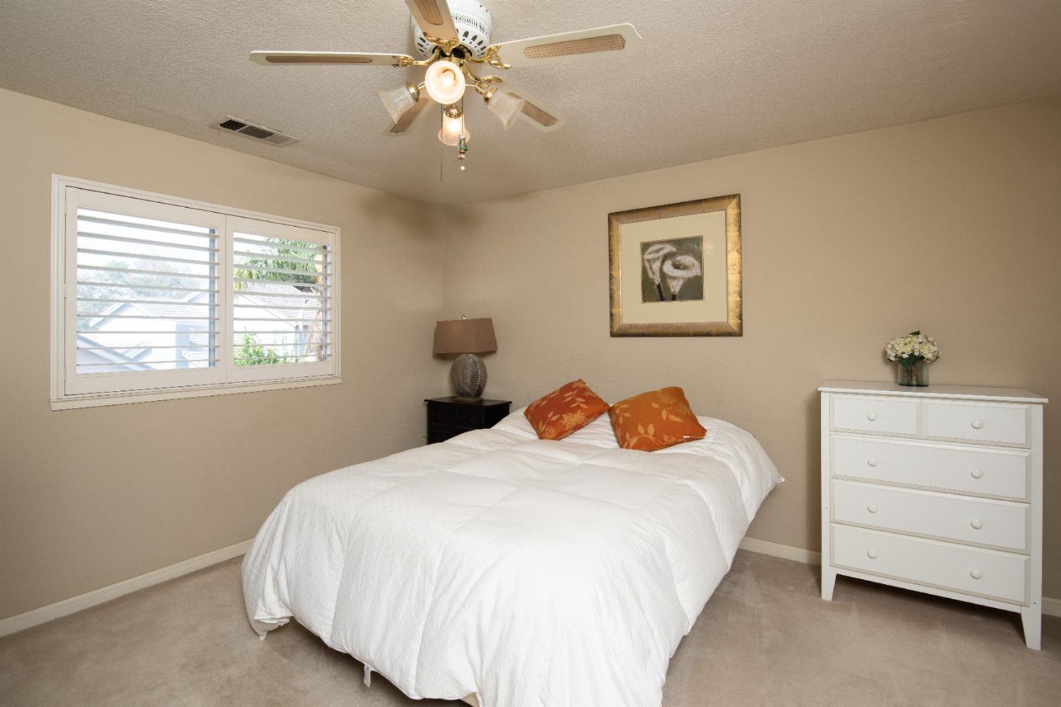 2705 Lake Front Court Modesto, CA 95355 - Photo 37 of 50 a bedroom with a bed and a dresser