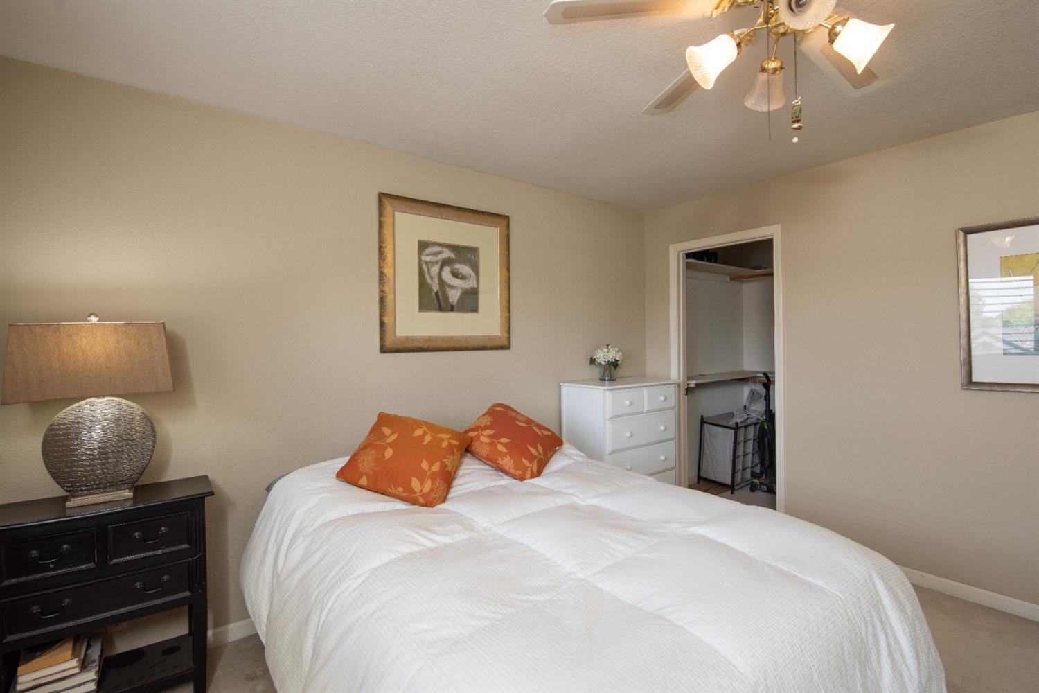 2705 Lake Front Court Modesto, CA 95355 - Photo 38 of 50 a bedroom with a bed and a lamp