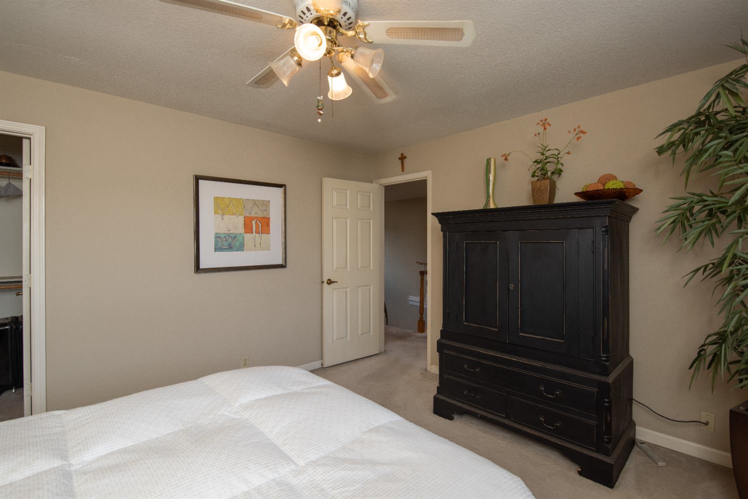 2705 Lake Front Court Modesto, CA 95355 - Photo 39 of 50 a bedroom with a bed and cabinets