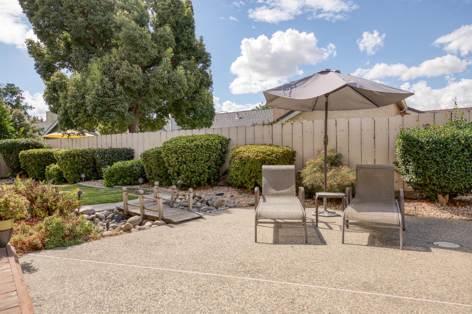 2705 Lake Front Court Modesto, CA 95355 - Photo 44 of 50 a view of backyard with outdoor seating and plants