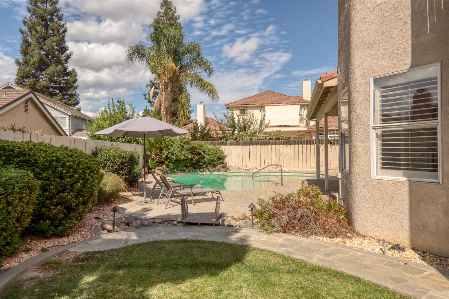 2705 Lake Front Court Modesto, CA 95355 - Photo 50 of 50 a swimming pool with outdoor seating yard and barbeque oven