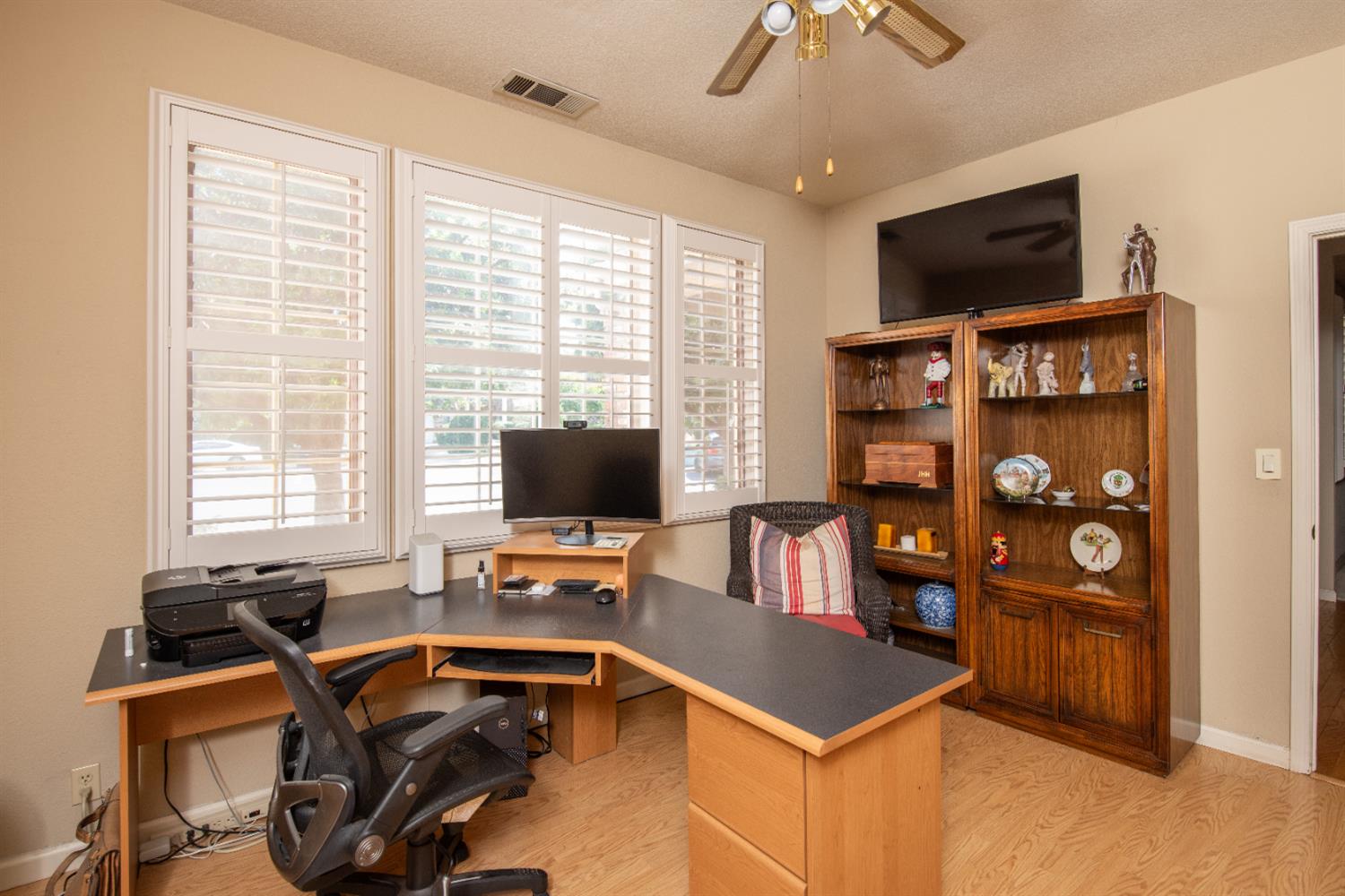 2705 Lake Front Court Modesto, CA 95355 - Photo 9 of 50 a work room with furniture a flat screen tv and a window