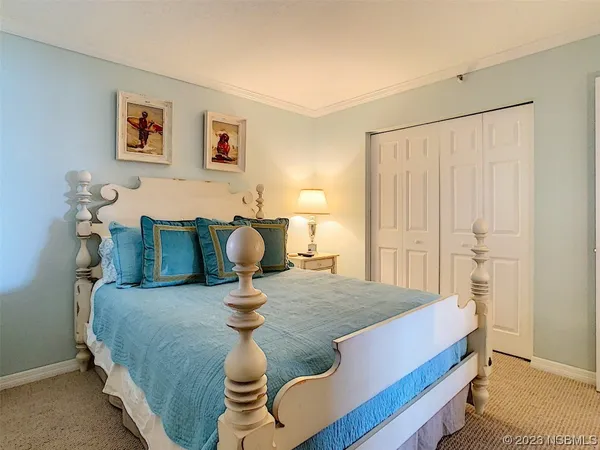 a bedroom with a bed and the cabinet