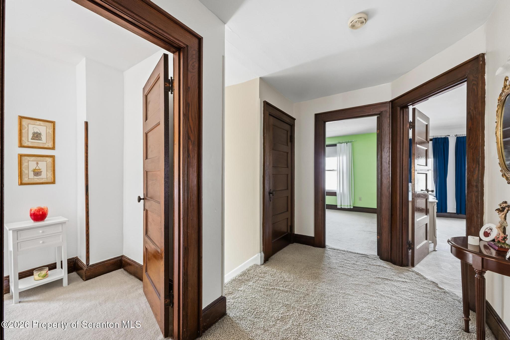 616 Myrtle Street Scranton, PA 18510 - Photo 24 of 65 a view of a livingroom with closet and mirror