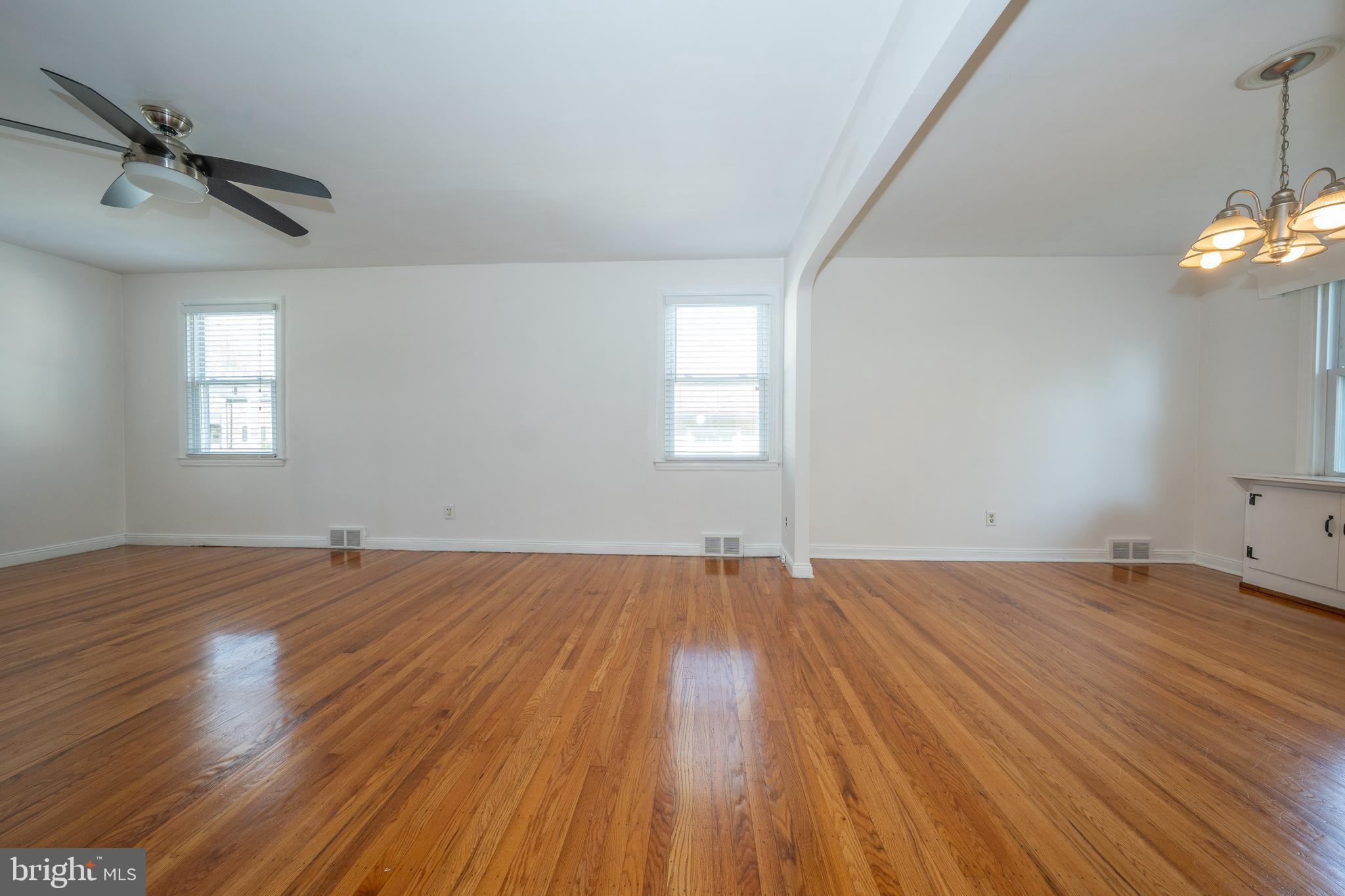 1305 Center Road Drexel Hill, PA 19026 - Photo 12 of 37 wooden floor in an empty room with a window