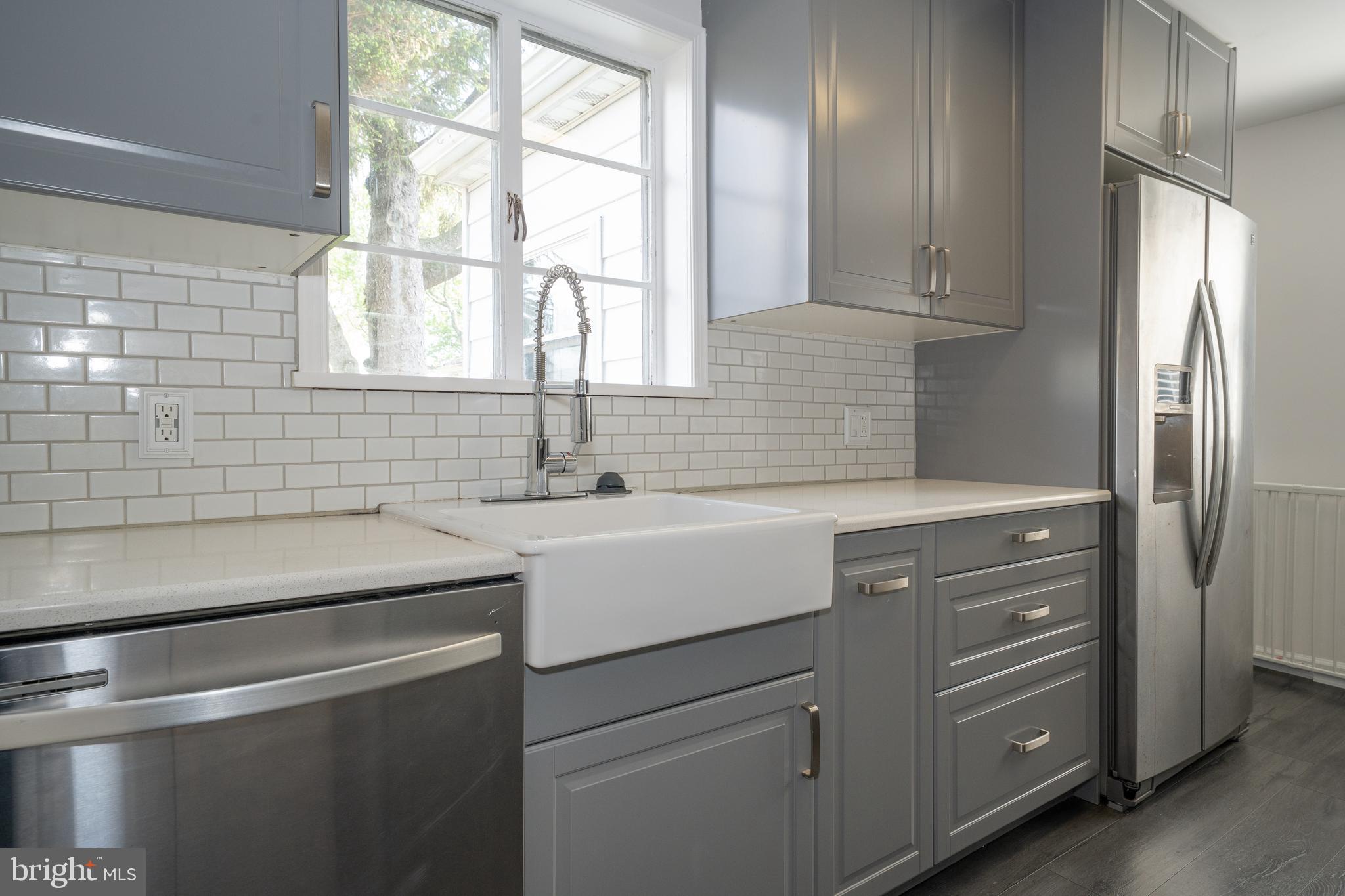 1305 Center Road Drexel Hill, PA 19026 - Photo 15 of 37 a view with cabinets a window and a sink