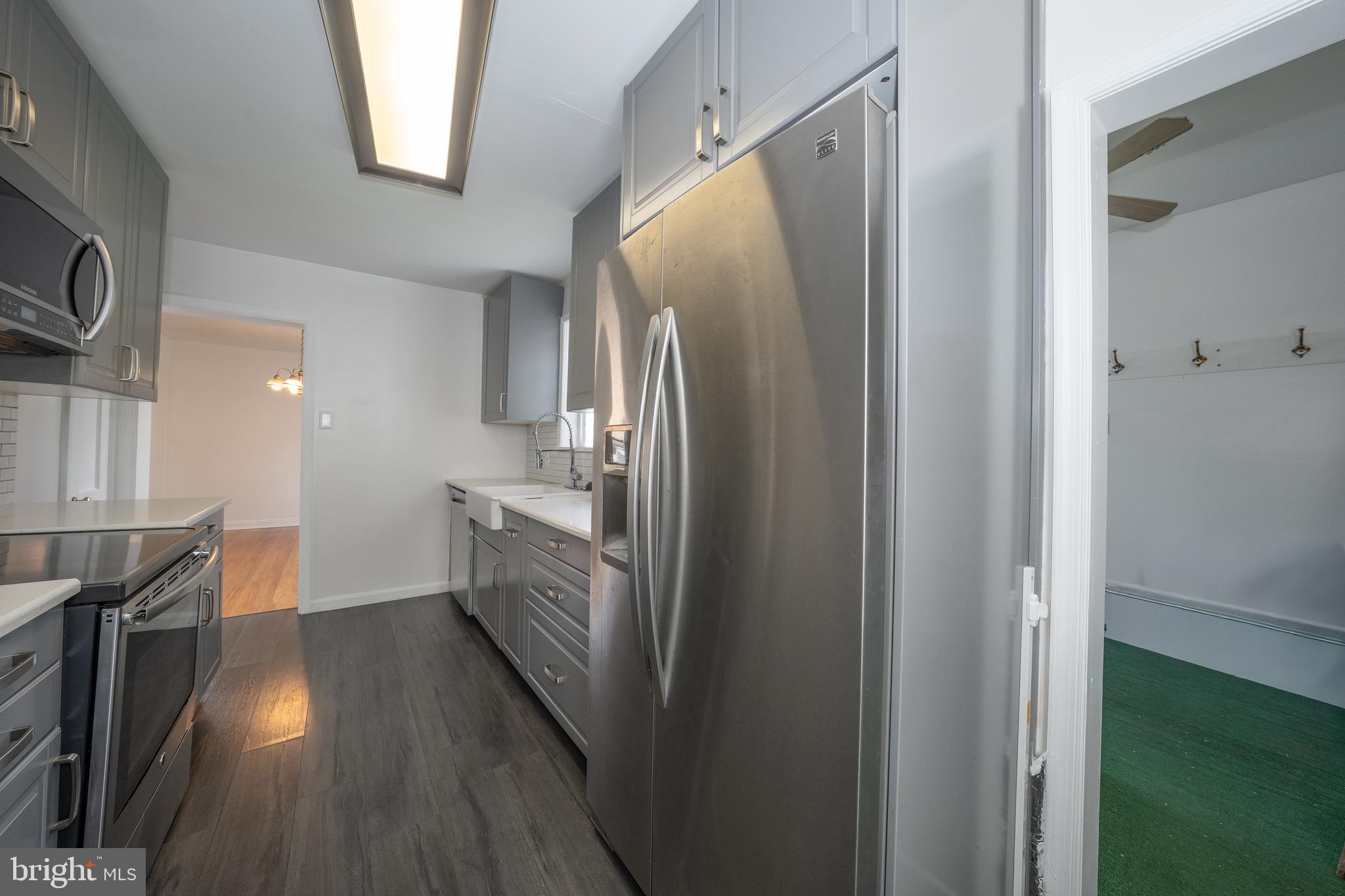 1305 Center Road Drexel Hill, PA 19026 - Photo 17 of 37 a kitchen with stainless steel appliances a refrigerator and a sink