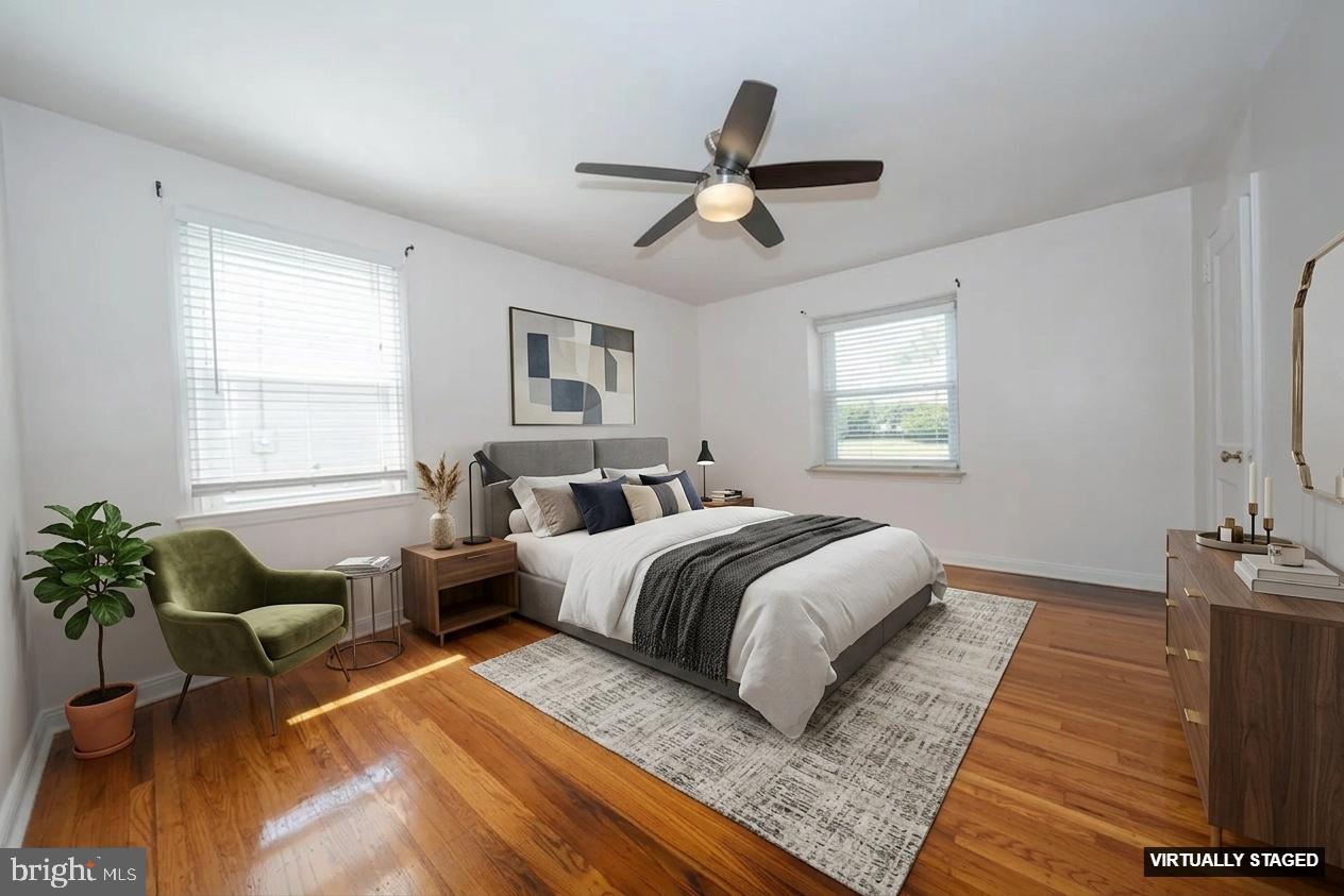 1305 Center Road Drexel Hill, PA 19026 - Photo 19 of 37 a bedroom with a bed and wooden floor