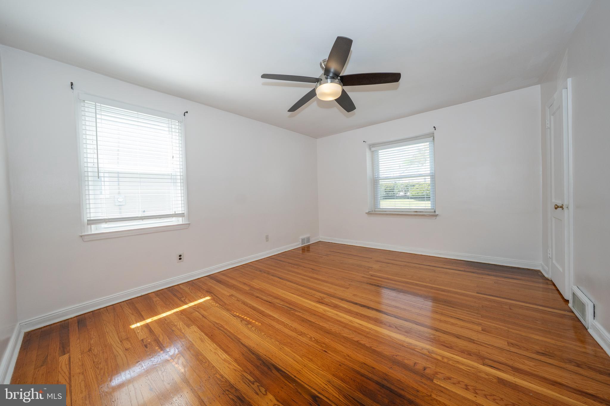 1305 Center Road Drexel Hill, PA 19026 - Photo 20 of 37 a view of a room with wooden floor and windows