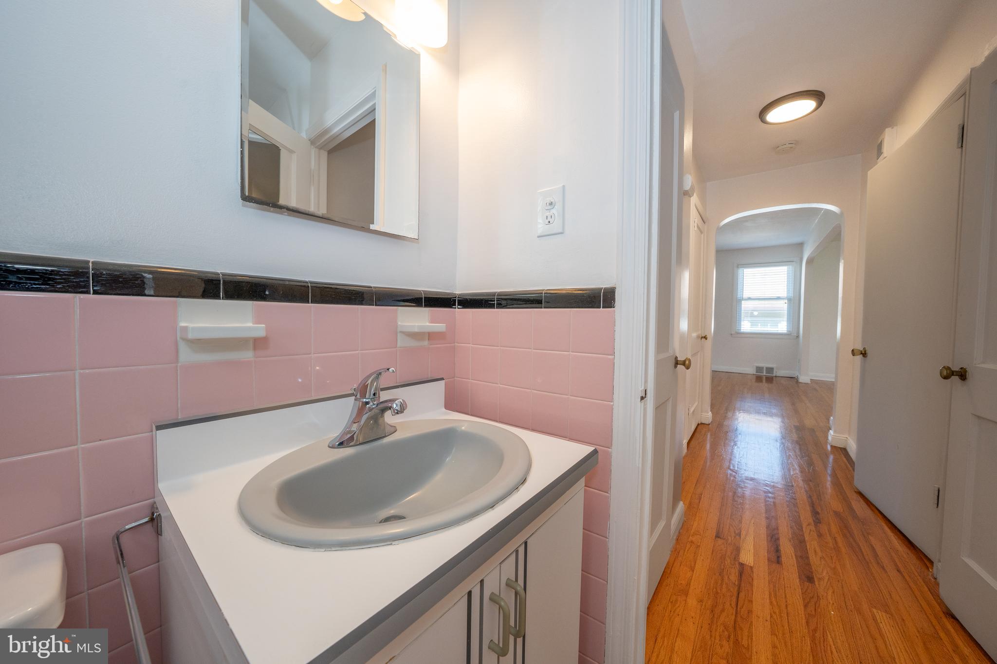 1305 Center Road Drexel Hill, PA 19026 - Photo 21 of 37 a bathroom with a sink and a mirror