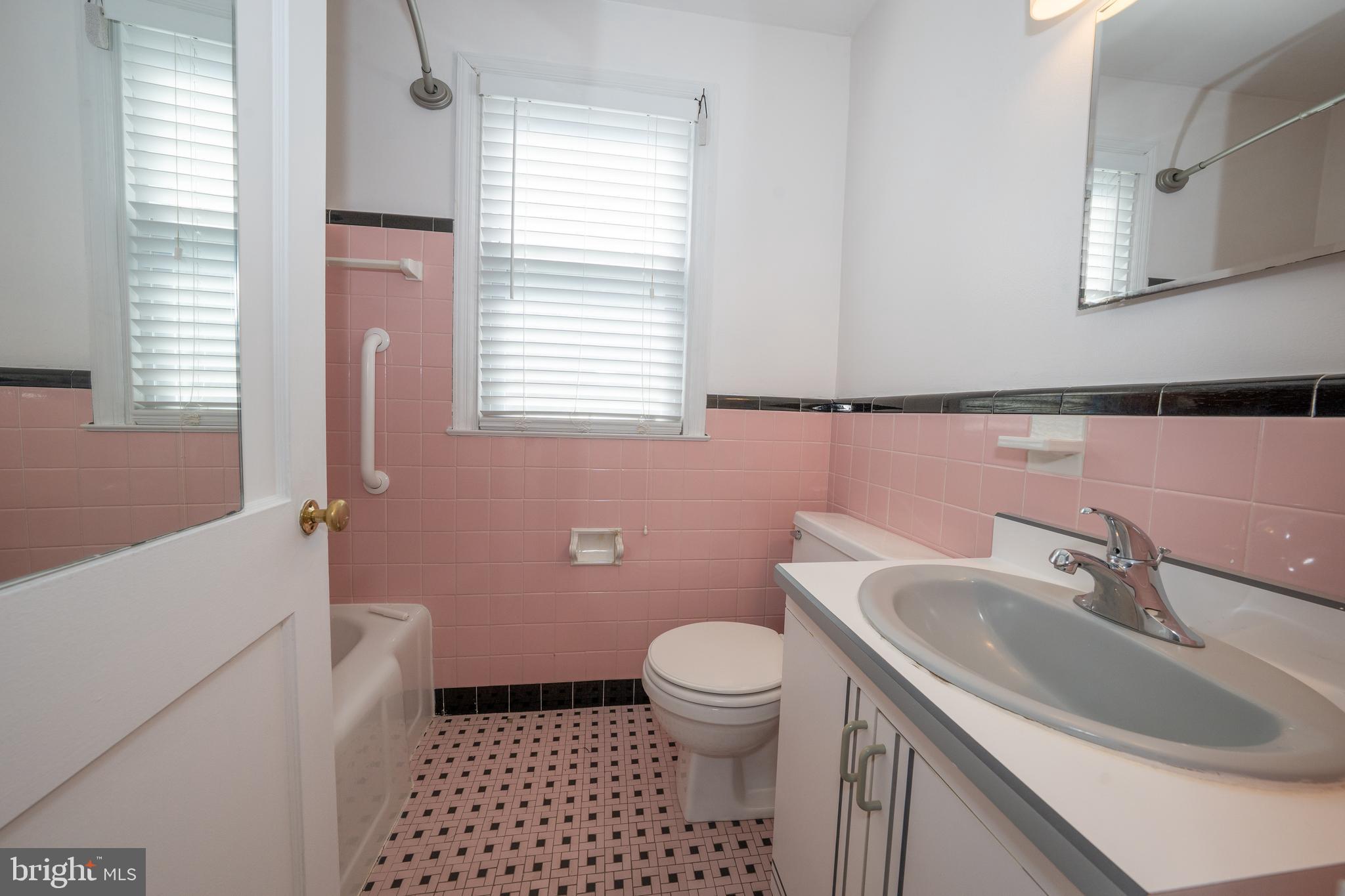 1305 Center Road Drexel Hill, PA 19026 - Photo 22 of 37 a bathroom with a sink toilet and window
