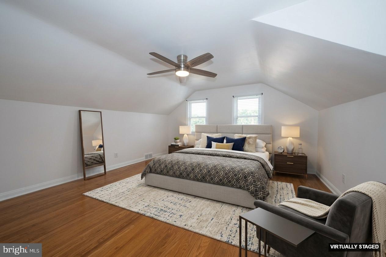 1305 Center Road Drexel Hill, PA 19026 - Photo 23 of 37 a spacious bedroom with a bed and a chandelier