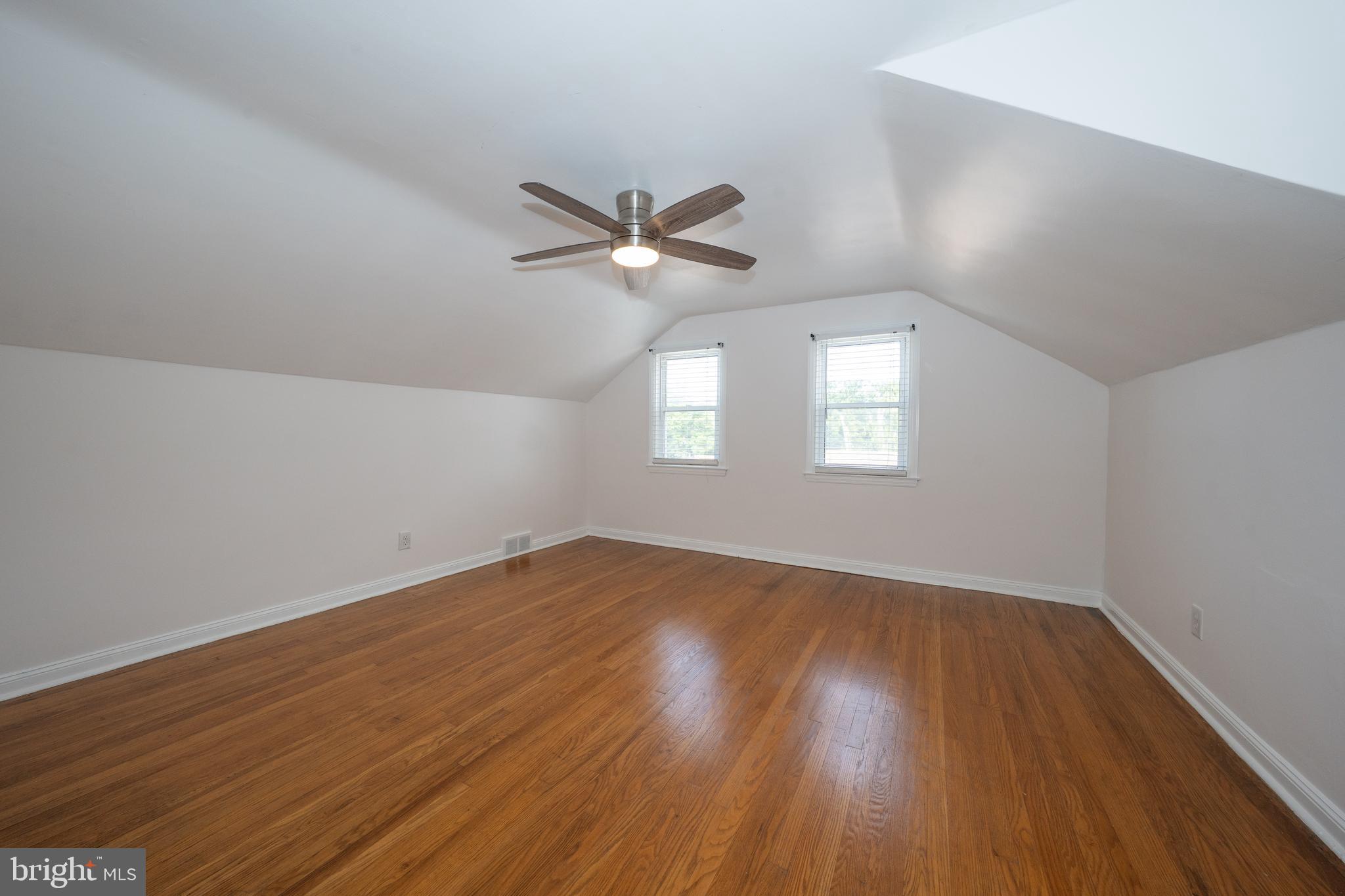 1305 Center Road Drexel Hill, PA 19026 - Photo 24 of 37 a view of an empty room with wooden floor and a window