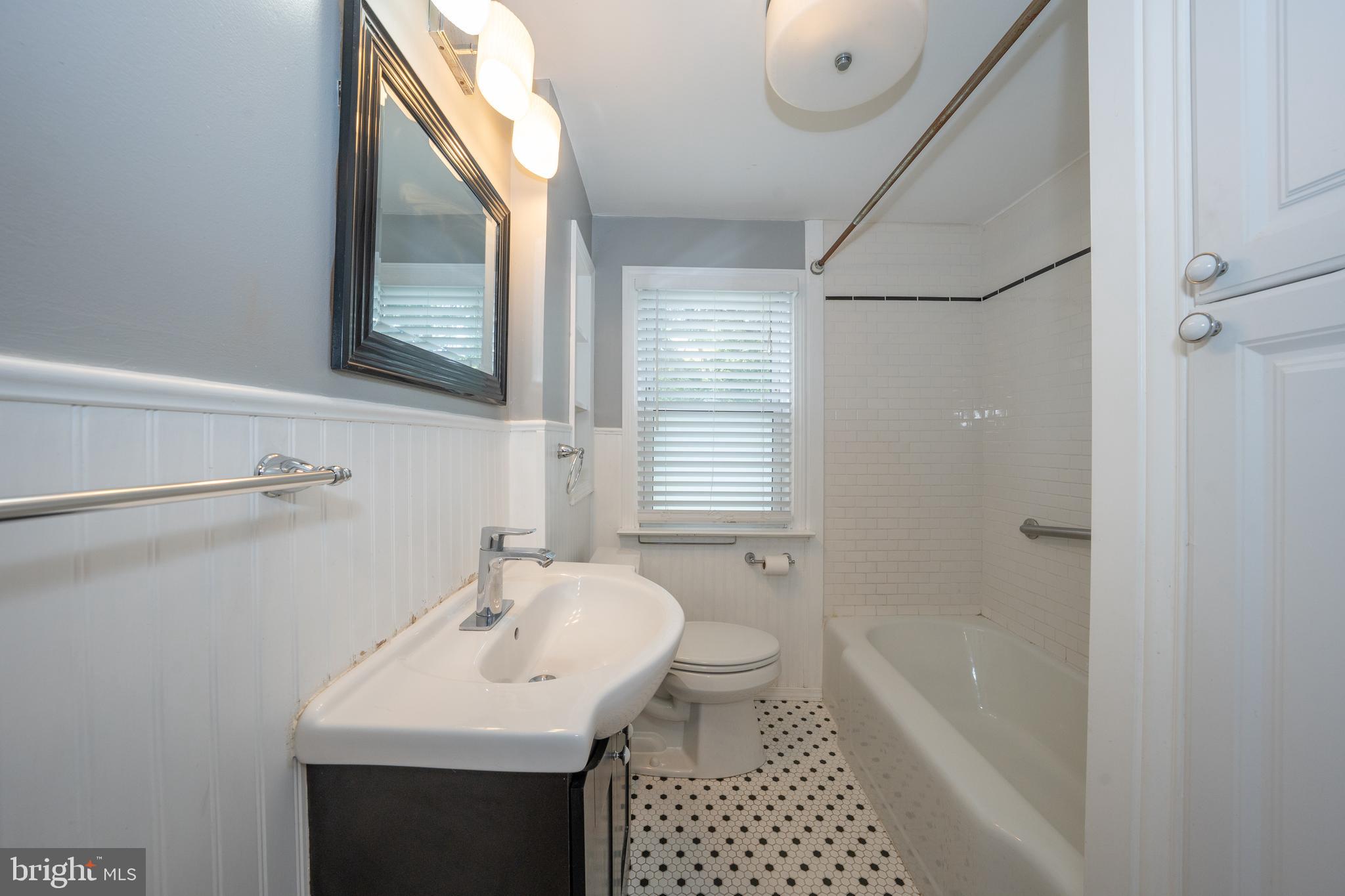 1305 Center Road Drexel Hill, PA 19026 - Photo 25 of 37 a bathroom with a sink a toilet and shower
