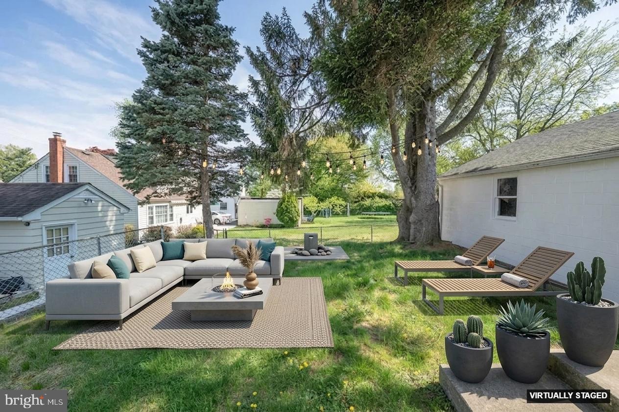 1305 Center Road Drexel Hill, PA 19026 - Photo 31 of 37 a view of a patio with couches chairs and a fire pit